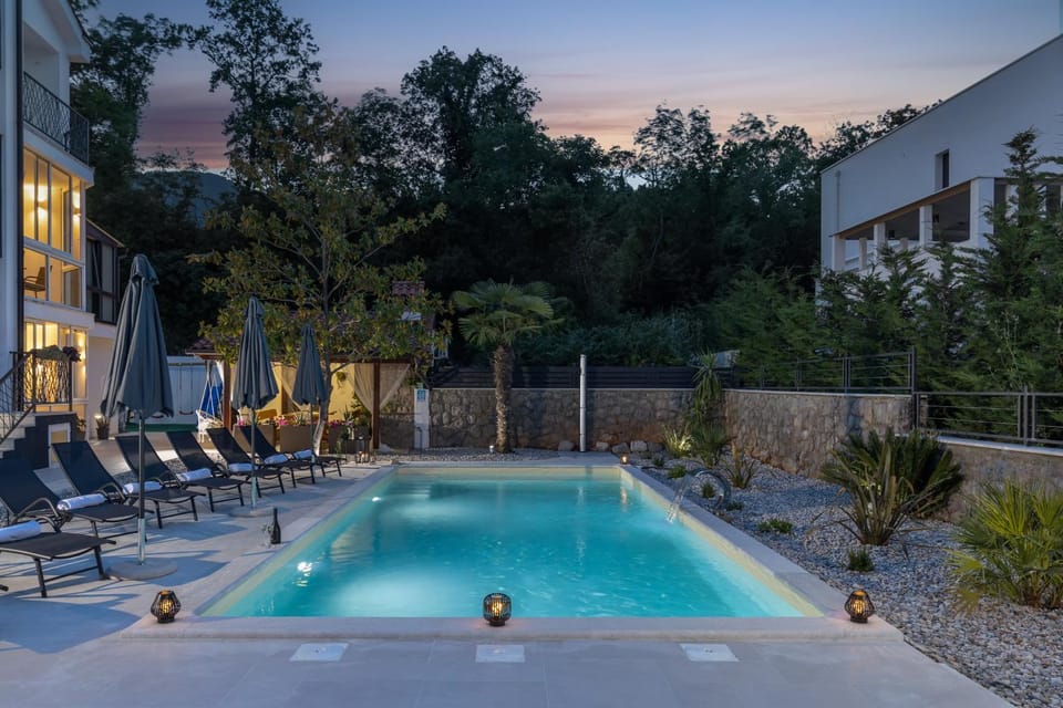 Property building, Patio, Night, Natural landscape, Pool view, Swimming pool, sunbed
