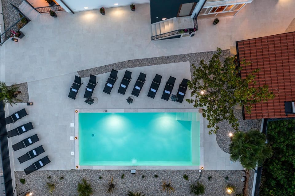Property building, Patio, Seating area, Pool view, Swimming pool, sunbed