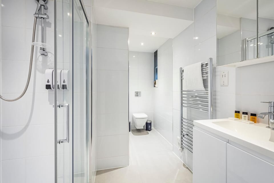 Shower, Toilet, Bathroom, hair dryier, towels