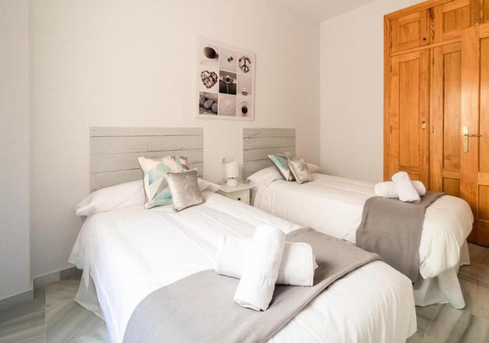 Bed, towels, wardrobe