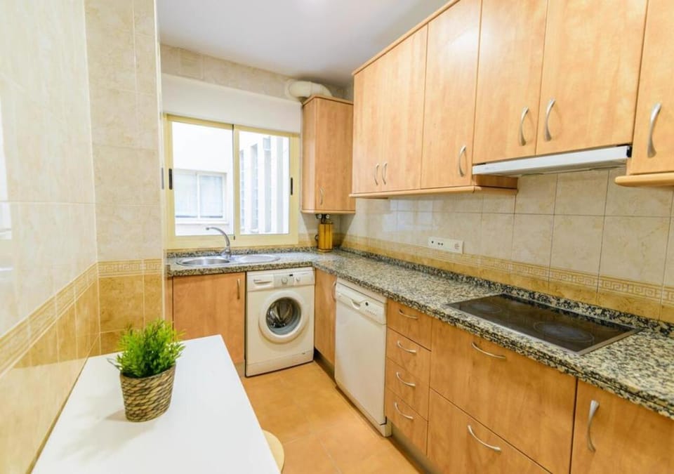 Kitchen or kitchenette, dishwasher, stove, washing machine