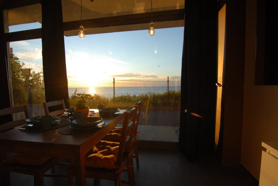 Natural landscape, View (from property/room), Dining area, Sea view, Sunset