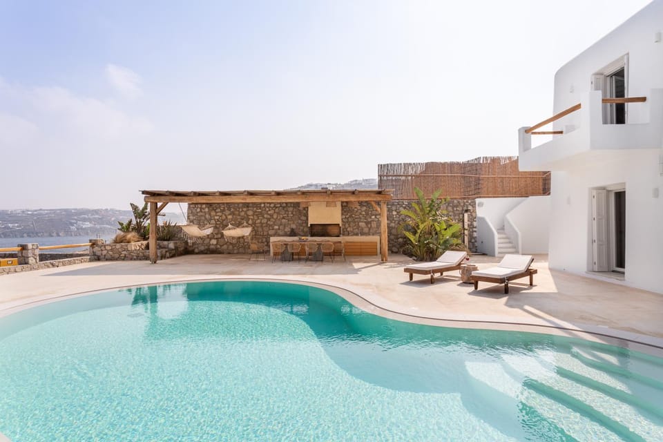 Property building, Patio, Day, Natural landscape, View (from property/room), Balcony/Terrace, Pool view, Sea view, Swimming pool, sunbed