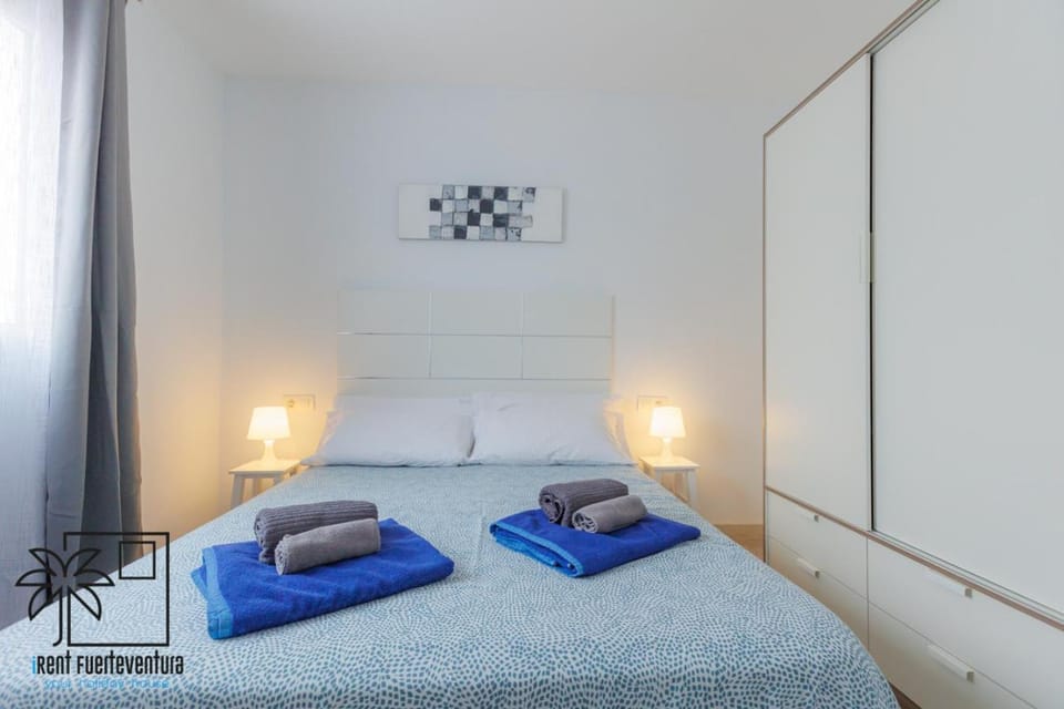 Bed, Bedroom, flat iron, towels, wardrobe
