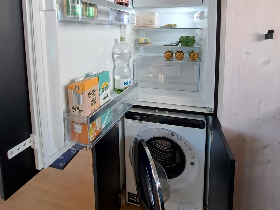 Kitchen or kitchenette, washing machine