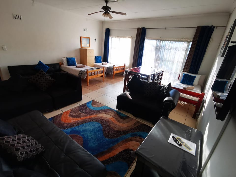Communal lounge/ TV room, Bed, Dining area