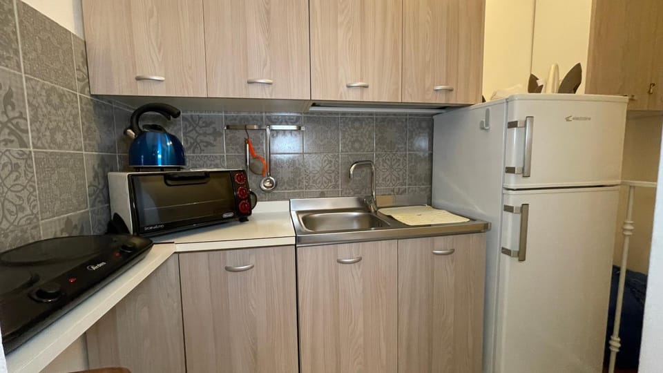 Kitchen or kitchenette, stove