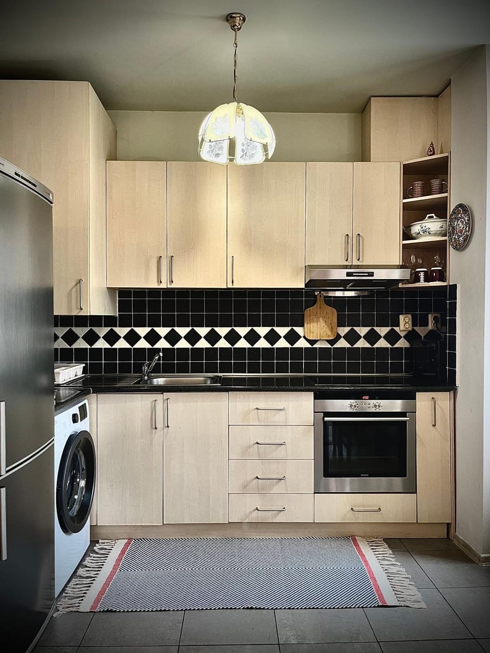 Kitchen or kitchenette, oven, stove, washing machine