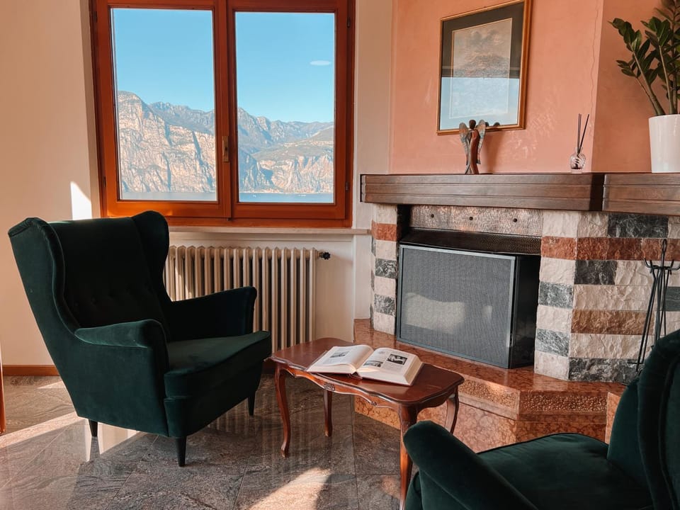 View (from property/room), Seating area, Lake view, Mountain view, fireplace