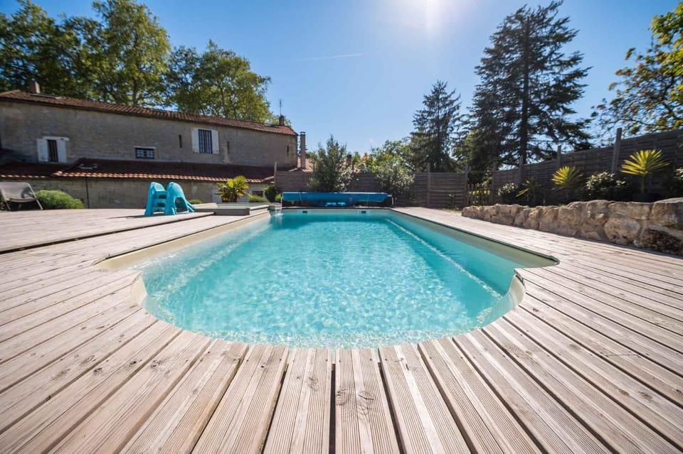 Property building, Day, Natural landscape, Pool view, Swimming pool, sunbed