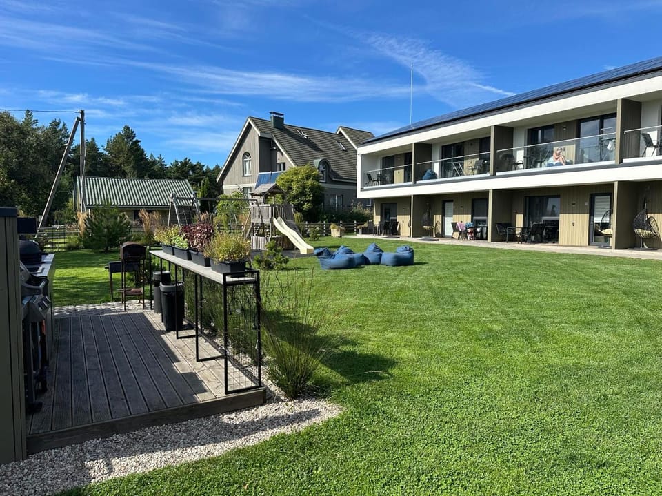 Property building, BBQ facilities, Children play ground, Seating area, Garden view