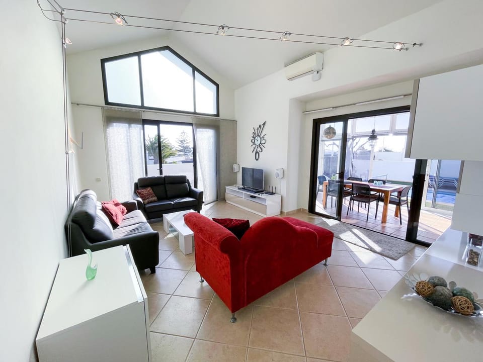 TV and multimedia, Living room, Seating area, Garden view, Pool view, locker, air conditioner