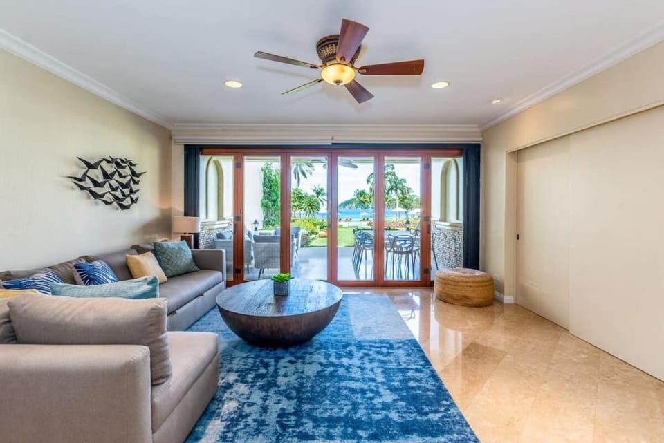 Stylish Split-Level Condo with a Shaded Terrace, Direct Beach Access, and Resort-Style Community Amenities House in Playa Flamingo