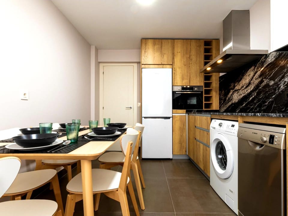 Kitchen or kitchenette, Dining area, dishwasher, washing machine, kitchen