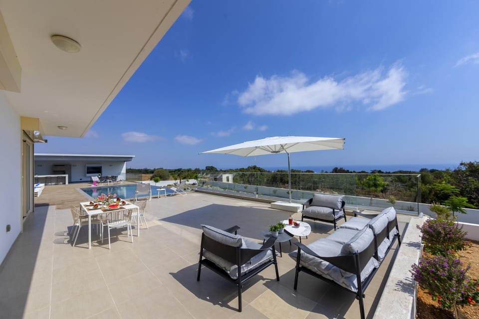 Patio, BBQ facilities, Garden, Seating area, Sea view, Swimming pool