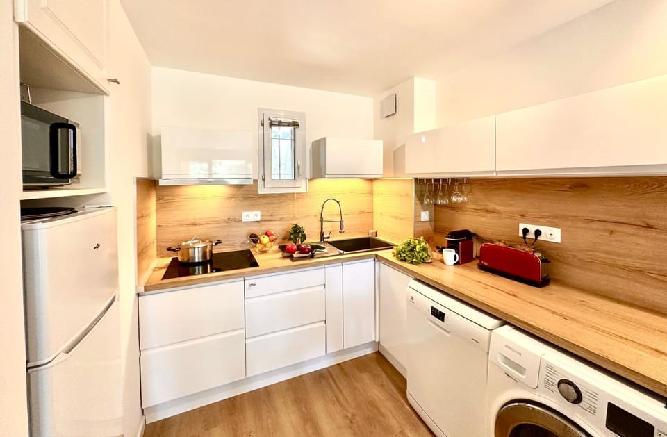 Kitchen or kitchenette, dishwasher, stove, toaster, washing machine