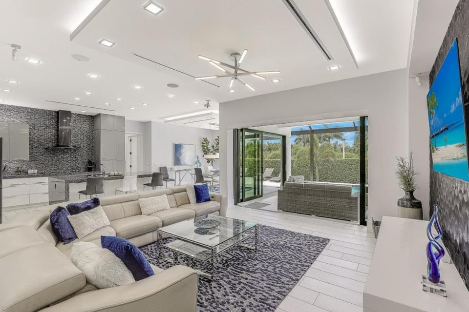 Modern home with outdoor kitchen and steps to beach House in Marco Island