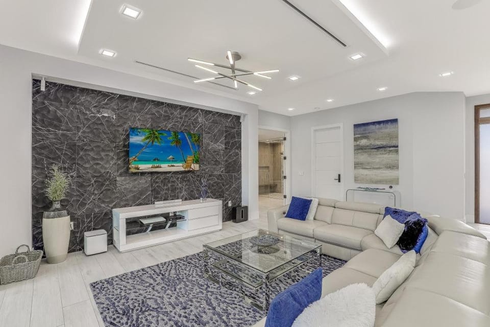 Modern home with outdoor kitchen and steps to beach House in Marco Island