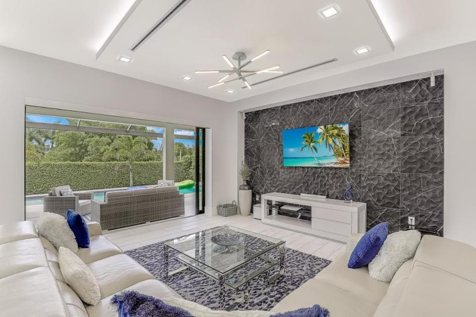 Modern home with outdoor kitchen and steps to beach House in Marco Island