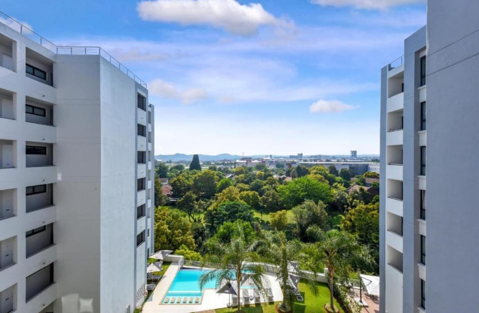 Property building, Day, Natural landscape, View (from property/room), City view, Pool view, Swimming pool