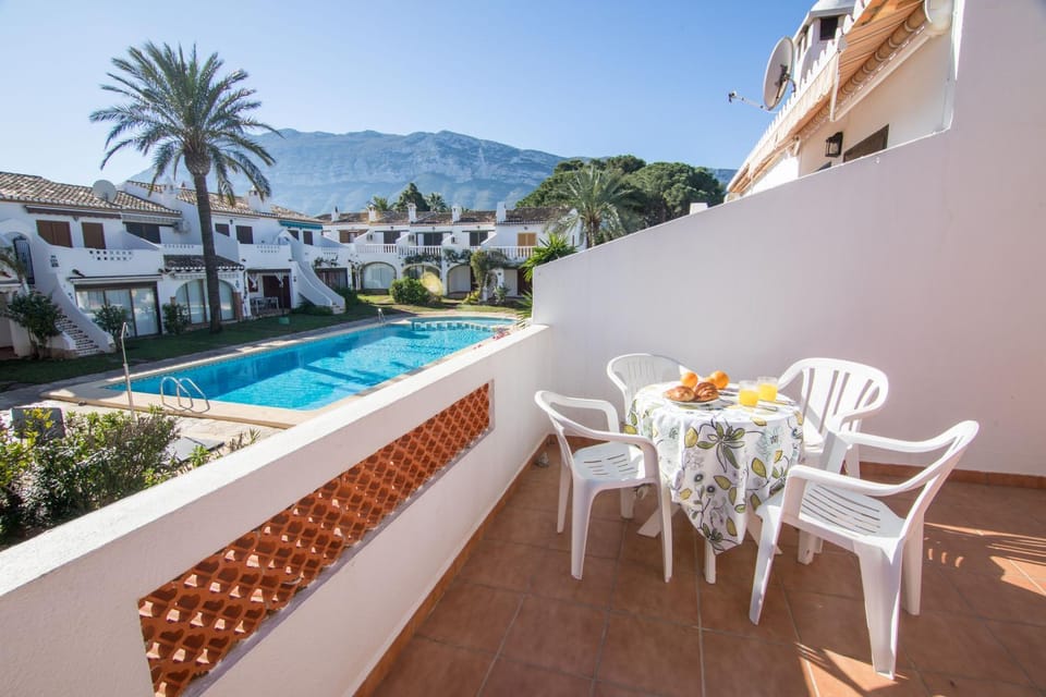Property building, Patio, Spring, Day, Natural landscape, View (from property/room), Balcony/Terrace, Dining area, Mountain view, Pool view, Swimming pool, sunbed