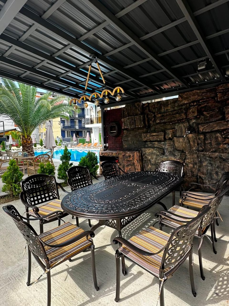 Patio, Day, Living room, Seating area, Dining area, Pool view, Swimming pool, sunbed