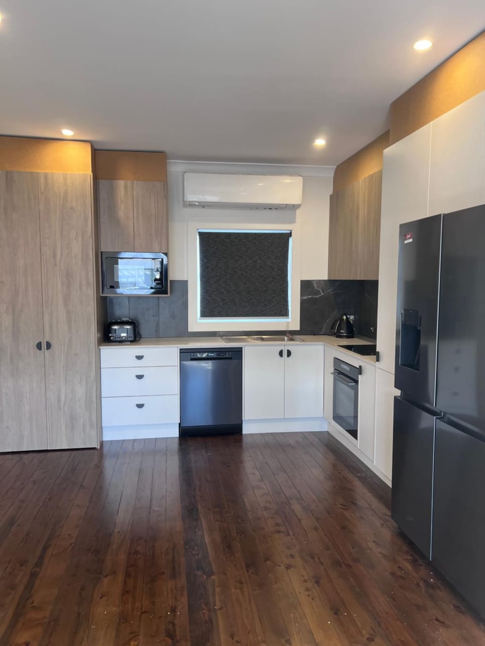 Kitchen or kitchenette, dishwasher, oven, stove, toaster