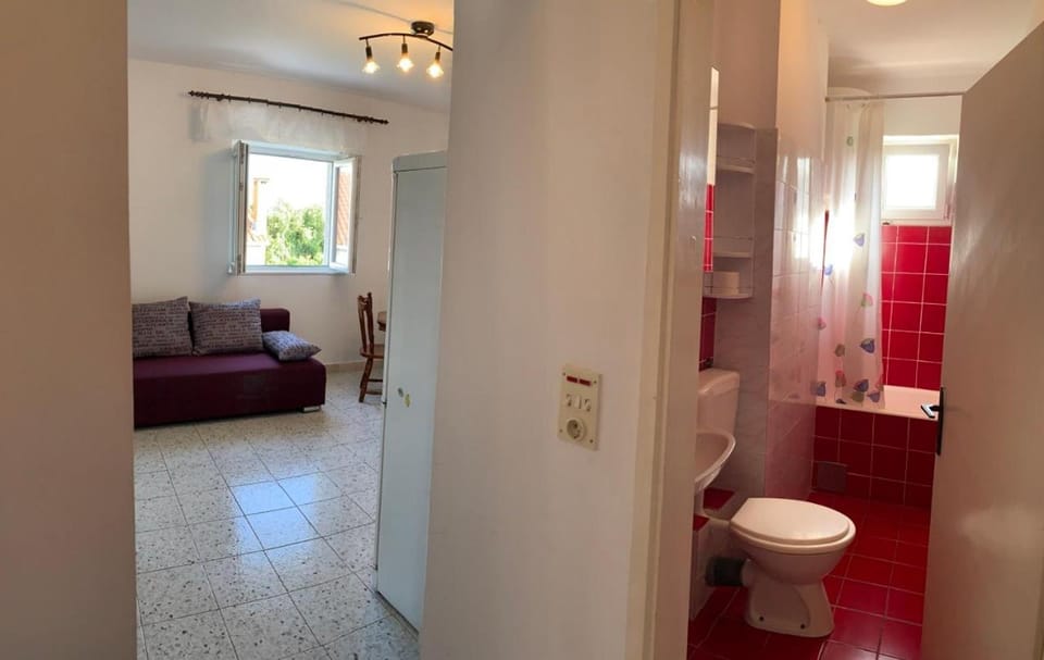Toilet, Bathroom, Living room, Seating area, Bath