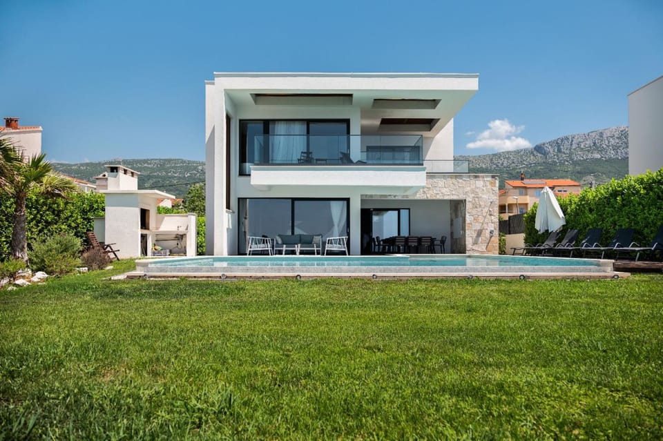 Beachfront Villa with Heated Infinity Pool and Direct Sea Access Kastela near Split Villa in Šibenik-Knin County, Croatia