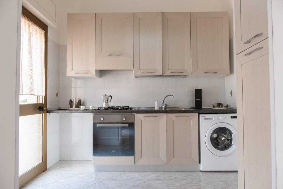 Kitchen or kitchenette, oven, stove, washing machine