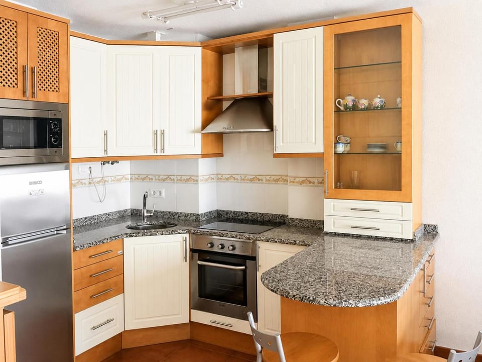 Kitchen or kitchenette, dishwasher, oven, stove, toaster