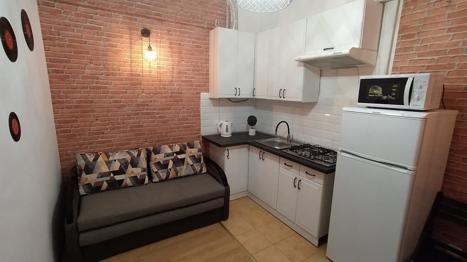 Coffee/tea facilities, Kitchen or kitchenette, Seating area, minibar, stove