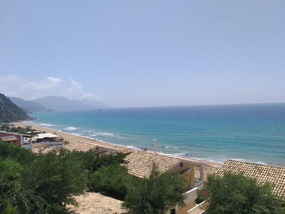 Property building, Nearby landmark, Day, Natural landscape, Beach, Mountain view, Sea view
