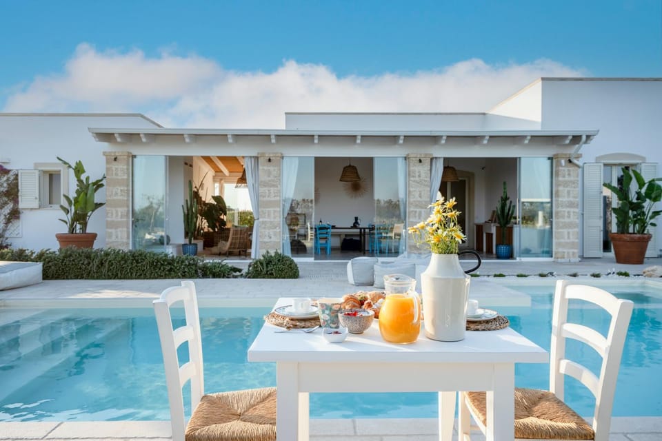 Property building, Patio, View (from property/room), Seating area, Dining area, Pool view, Swimming pool