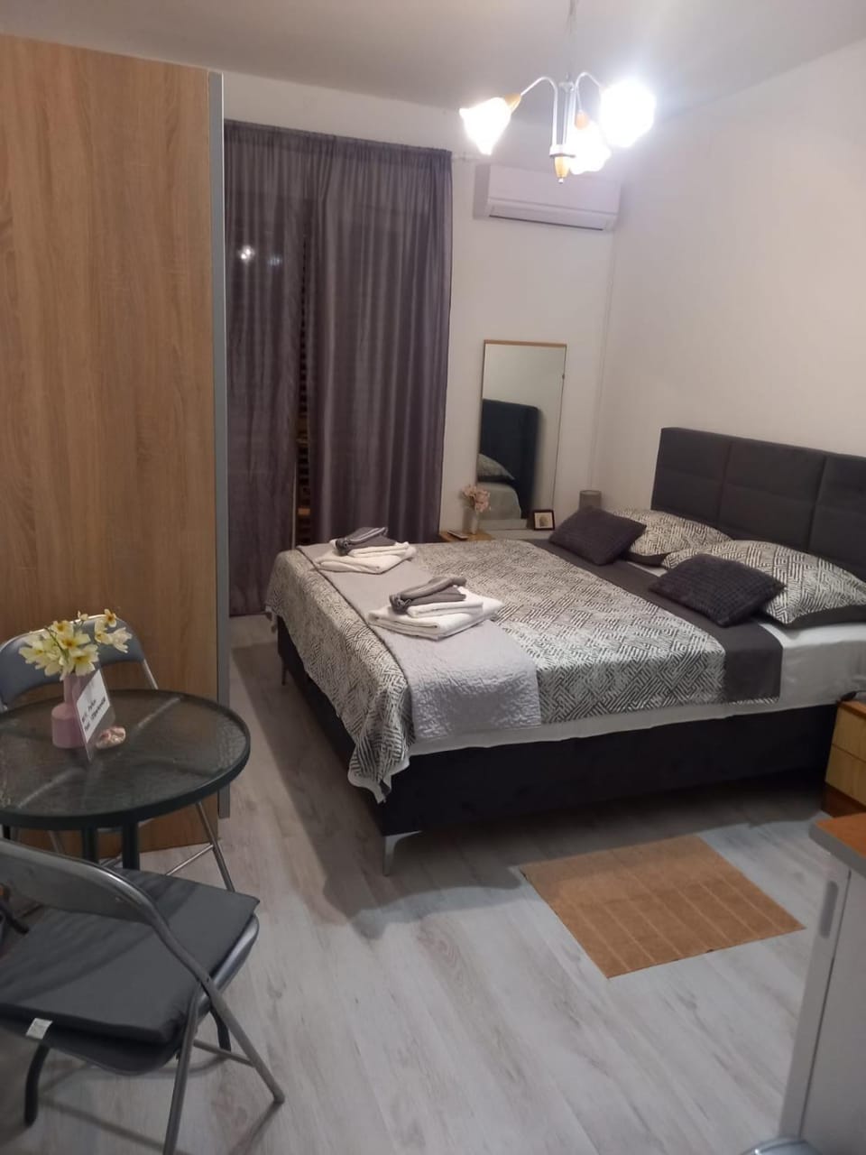 Bed, Seating area, towels, wardrobe