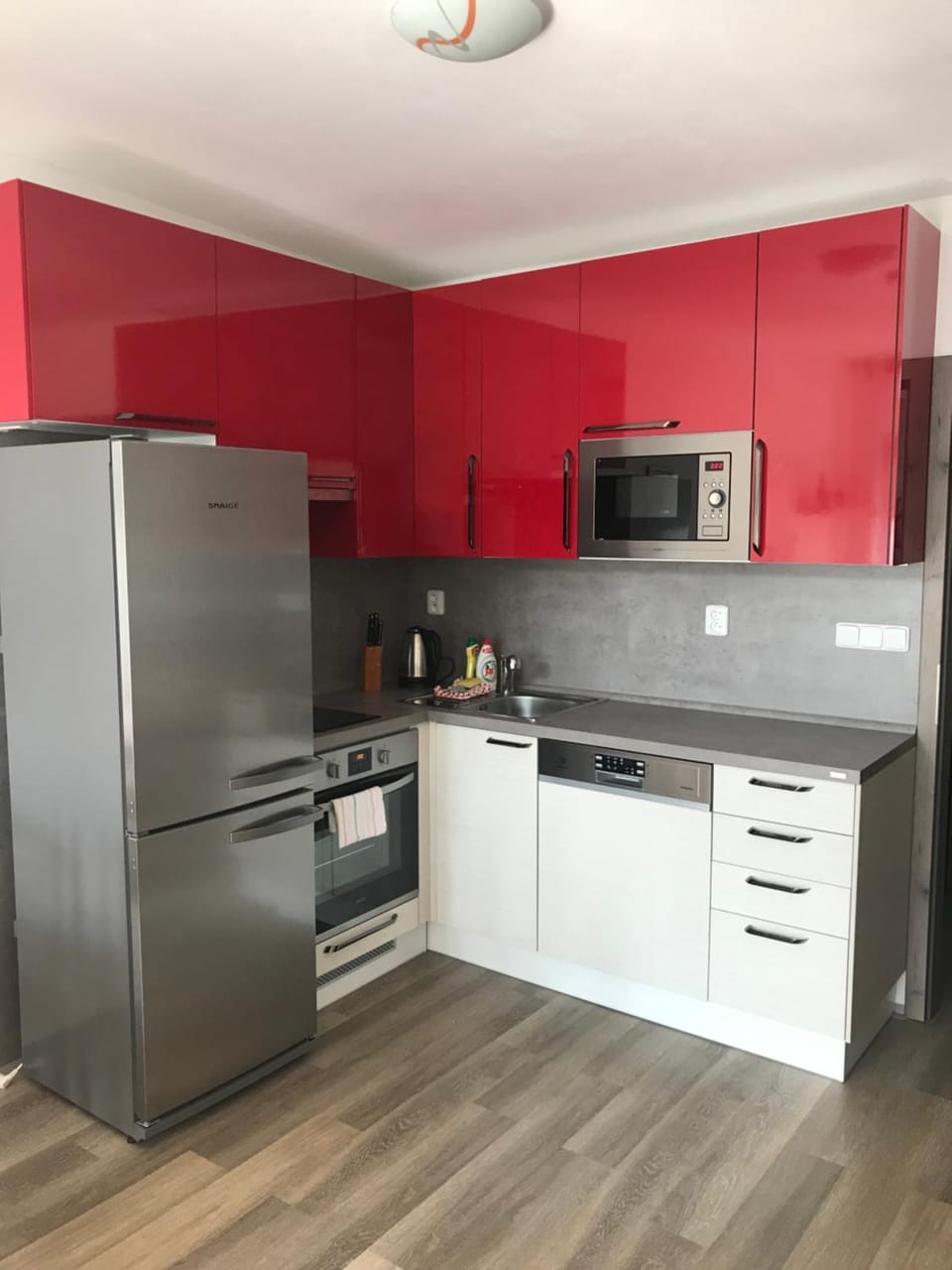 Kitchen or kitchenette, dishwasher, oven, stove