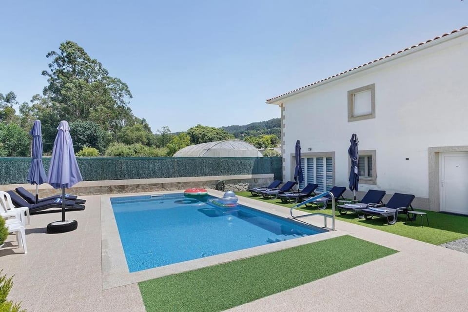 Patio, Day, Natural landscape, Pool view, Swimming pool, sunbed