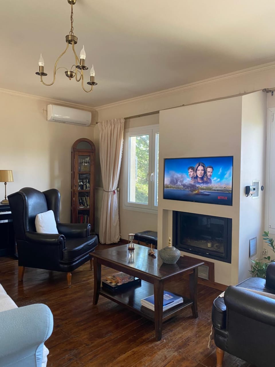 TV and multimedia, Living room, Seating area, fireplace, air conditioner