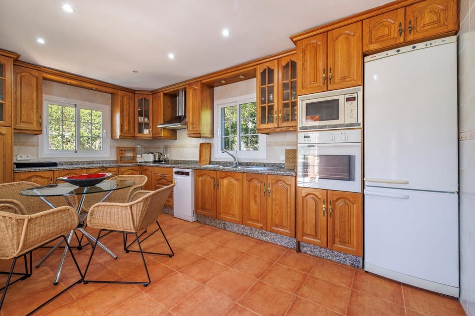 Kitchen or kitchenette, oven, stove, toaster