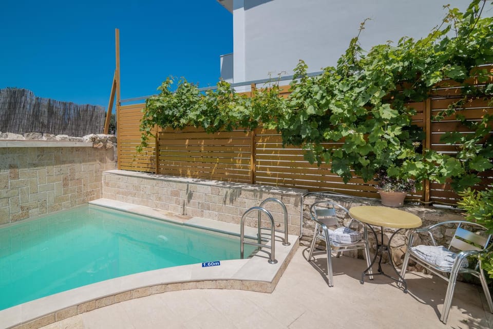 Patio, Day, Natural landscape, Pool view, Swimming pool, sunbed