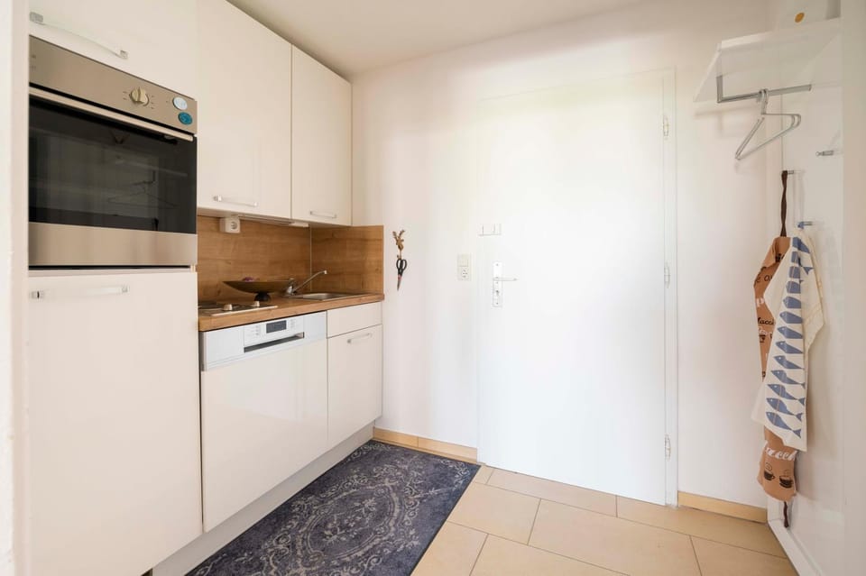 Kitchen or kitchenette, dishwasher, oven, stove