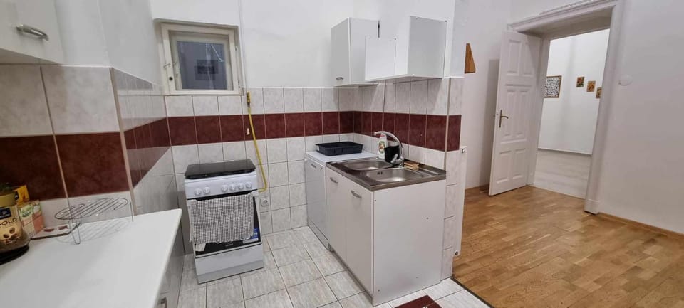 Kitchen or kitchenette, dishwasher, oven, stove