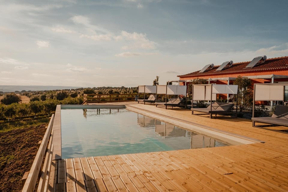 Property building, Natural landscape, Pool view, Swimming pool, sunbed