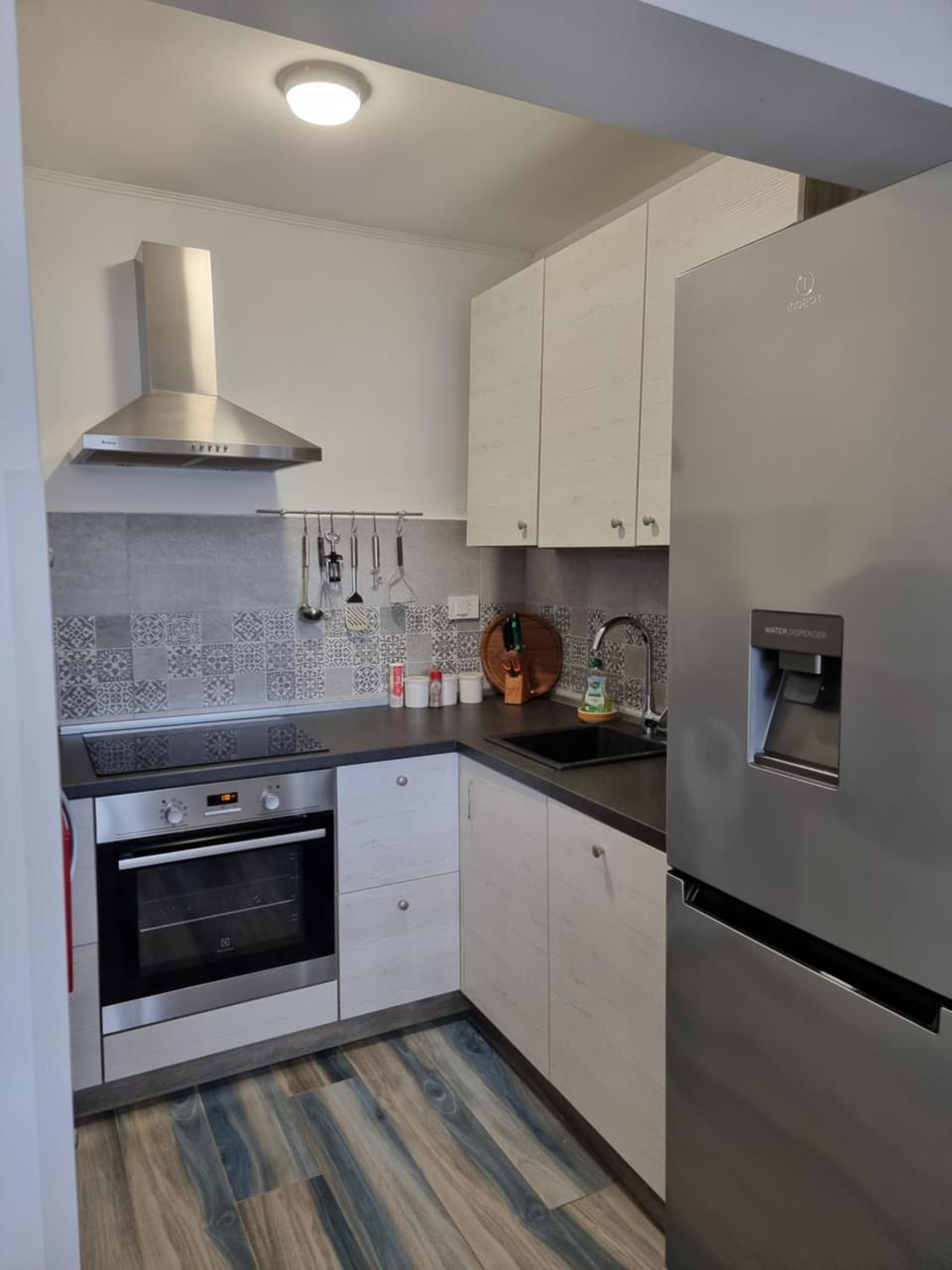 Kitchen or kitchenette, dishwasher, oven, stove, toaster