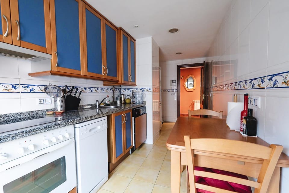 Kitchen or kitchenette, dishwasher, oven, stove, toaster