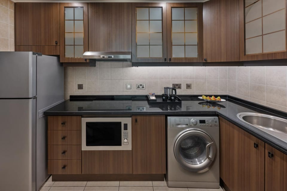 Kitchen or kitchenette, oven, stove, washing machine