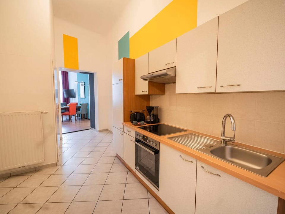 Kitchen or kitchenette, dishwasher, oven, stove