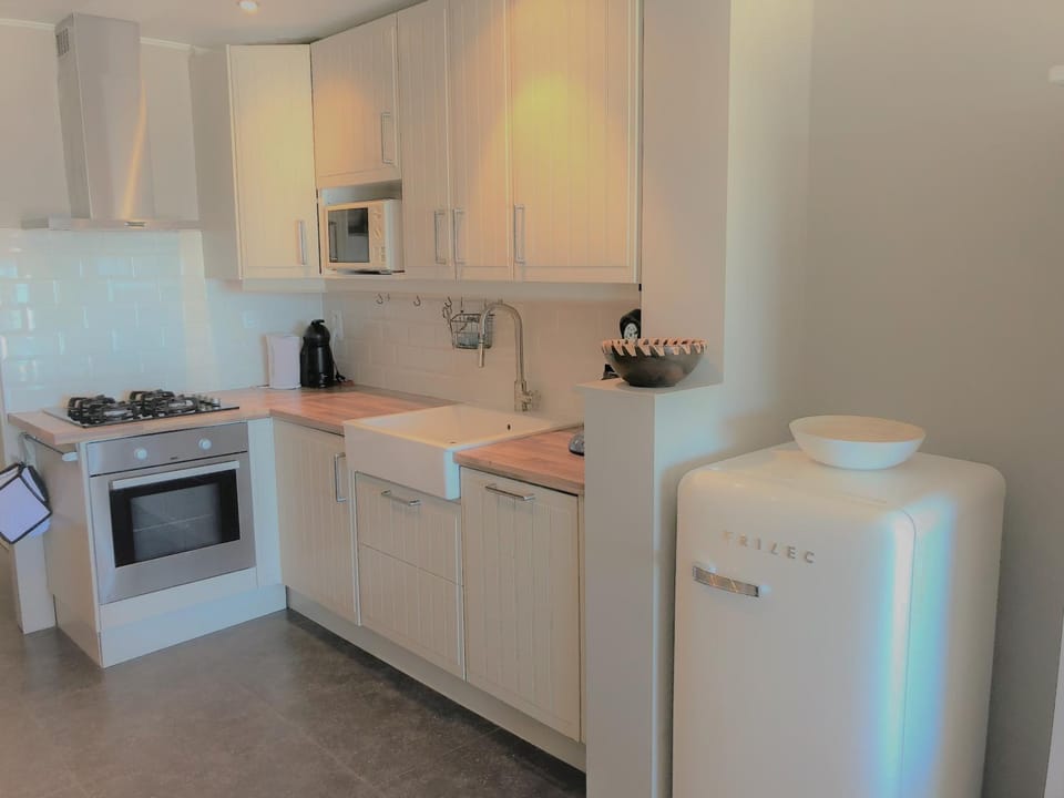 Kitchen or kitchenette, dishwasher, oven, stove, toaster