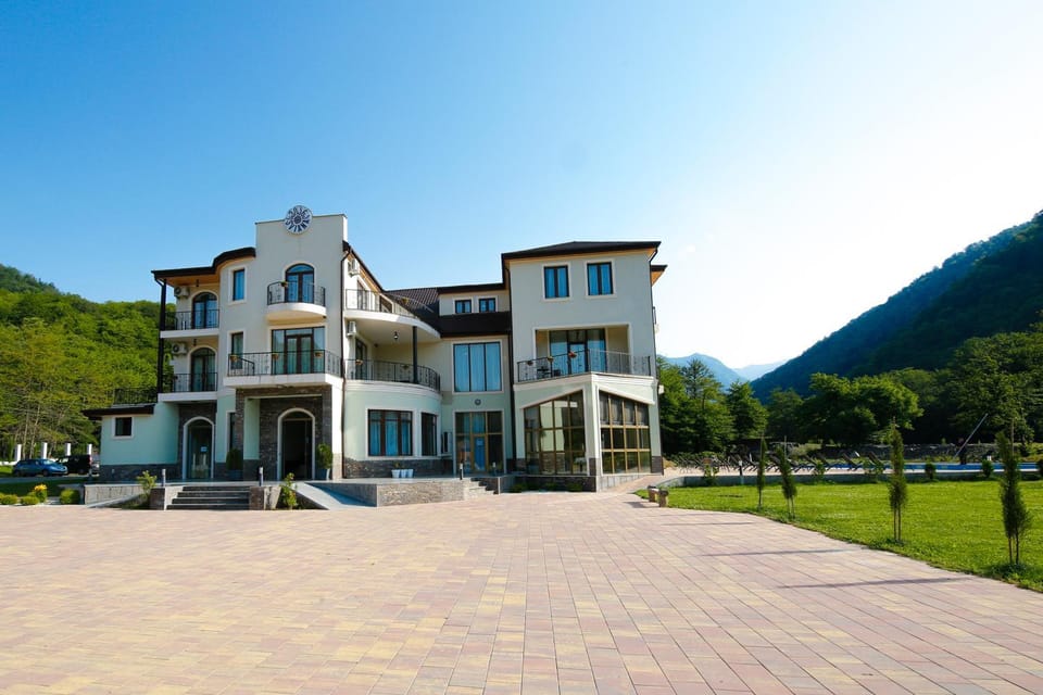 Property building, Facade/entrance, Spring, Natural landscape, Garden view, Mountain view