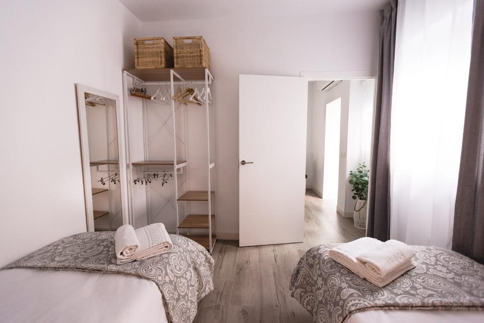 Bed, towels, wardrobe